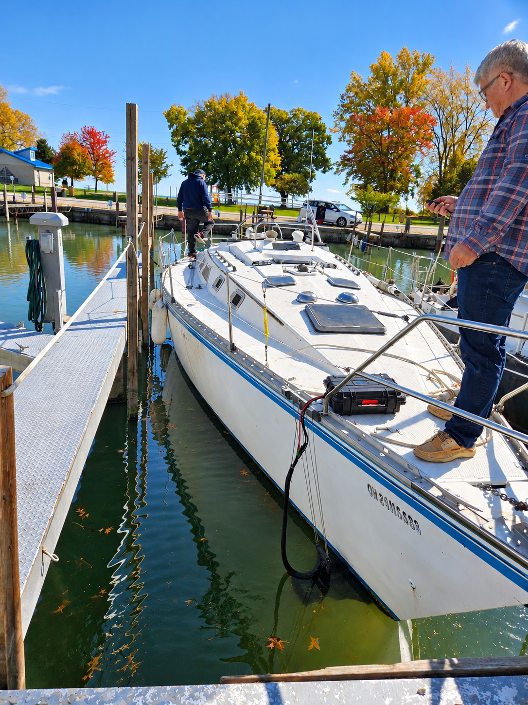 Sailboat maneuvering in a marina